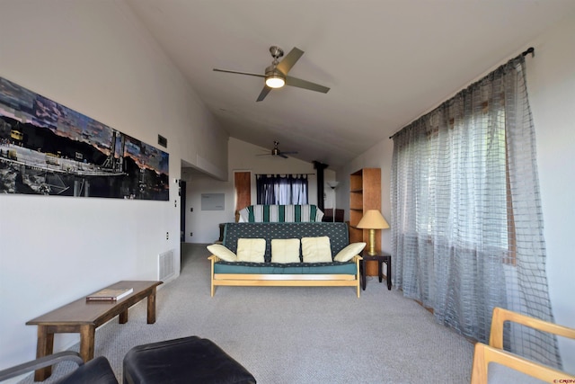 living room with vaulted ceiling, carpet, a ceiling fan, and visible vents