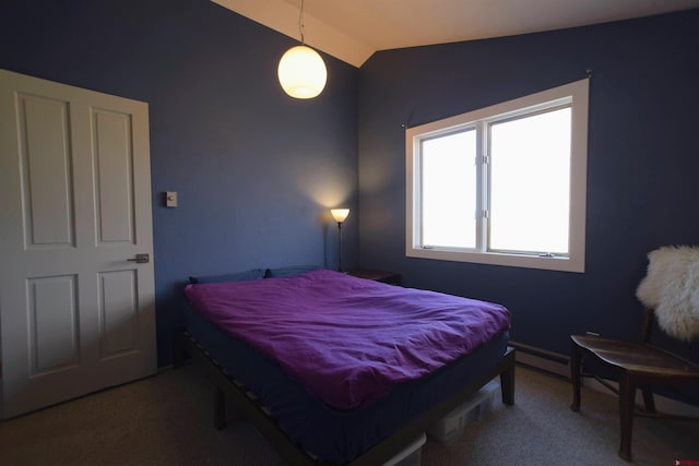 bedroom with carpet floors, a baseboard heating unit, and lofted ceiling