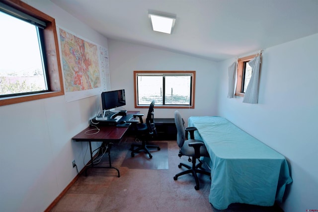 office space with carpet floors and vaulted ceiling
