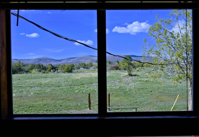 mountain view featuring a rural view