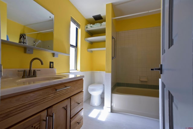bathroom with vanity, tub / shower combination, and toilet