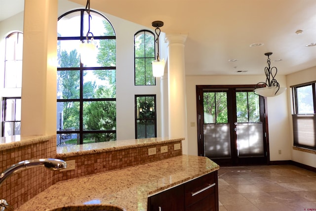 doorway featuring a sink, tile patterned flooring, french doors, recessed lighting, and baseboards