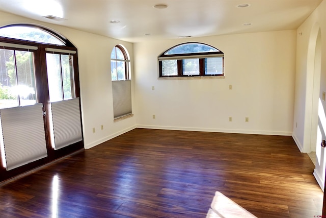 foyer entrance with french doors, baseboards, visible vents, and wood finished floors