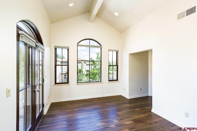 empty room with visible vents, dark wood-style flooring, beamed ceiling, baseboards, and high vaulted ceiling