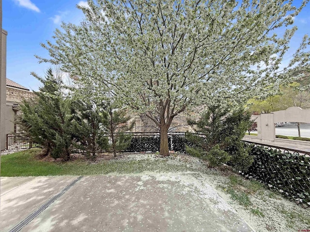 view of patio / terrace featuring fence