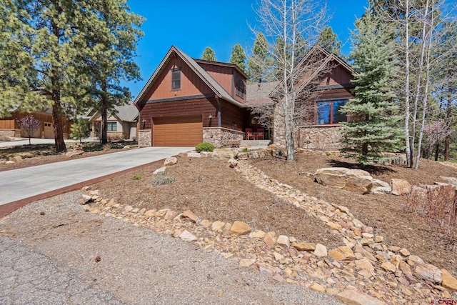 300 Copper Rim Trl, Durango, CO 81301 - log-style house with an attached garage, driveway, and stone siding