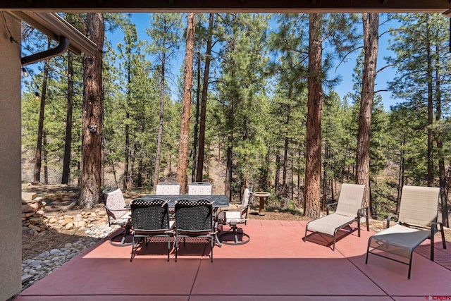 300 Copper Rim Trl, Durango, CO 81301 - view of patio featuring outdoor dining area and a forest view