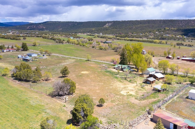 bird's eye view featuring a rural view and a mountain view