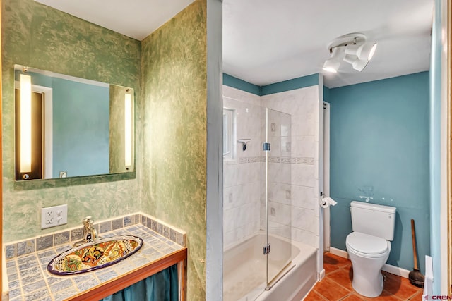 full bathroom with vanity, toilet, tile patterned floors, baseboards, and  shower combination