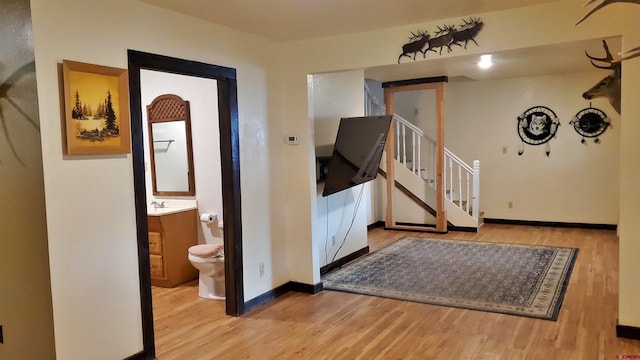 108 N 15th St, Dolores, CO 81323 - foyer entrance featuring baseboards, wood finished floors, and stairway