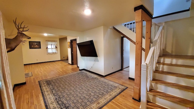 108 N 15th St, Dolores, CO 81323 - interior space with baseboards, stairs, wood finished floors, and visible vents