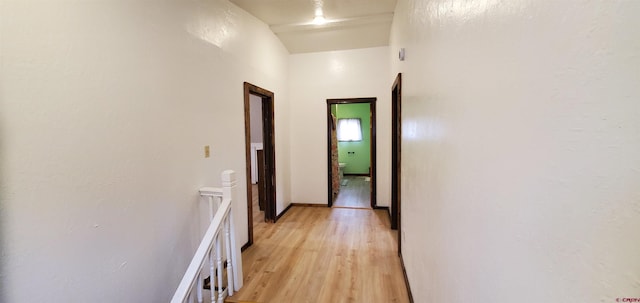 108 N 15th St, Dolores, CO 81323 - hall featuring lofted ceiling, light wood-style flooring, and an upstairs landing