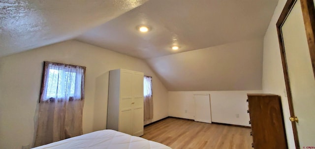 108 N 15th St, Dolores, CO 81323 - bedroom featuring baseboards, light wood-style flooring, and lofted ceiling