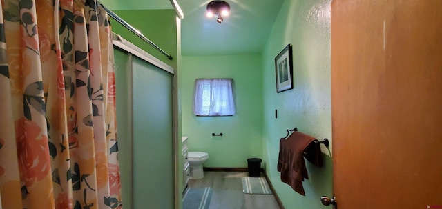 108 N 15th St, Dolores, CO 81323 - full bathroom featuring a shower with curtain, baseboards, and toilet