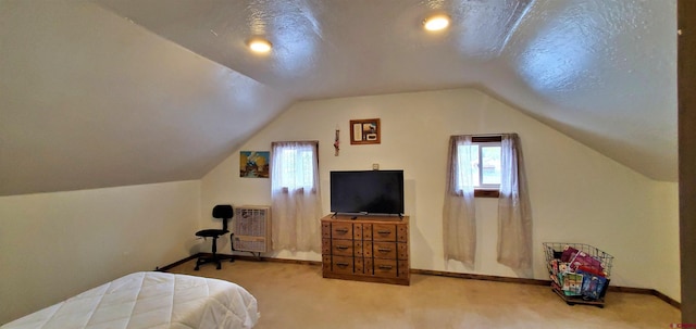 108 N 15th St, Dolores, CO 81323 - carpeted bedroom featuring baseboards, heating unit, and lofted ceiling