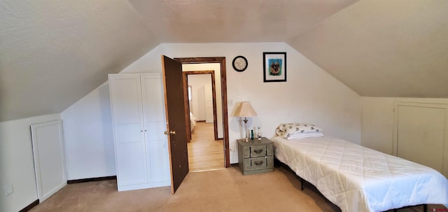 108 N 15th St, Dolores, CO 81323 - bedroom featuring light carpet and vaulted ceiling