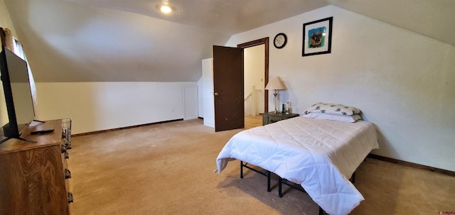 108 N 15th St, Dolores, CO 81323 - bedroom featuring light colored carpet, baseboards, and vaulted ceiling