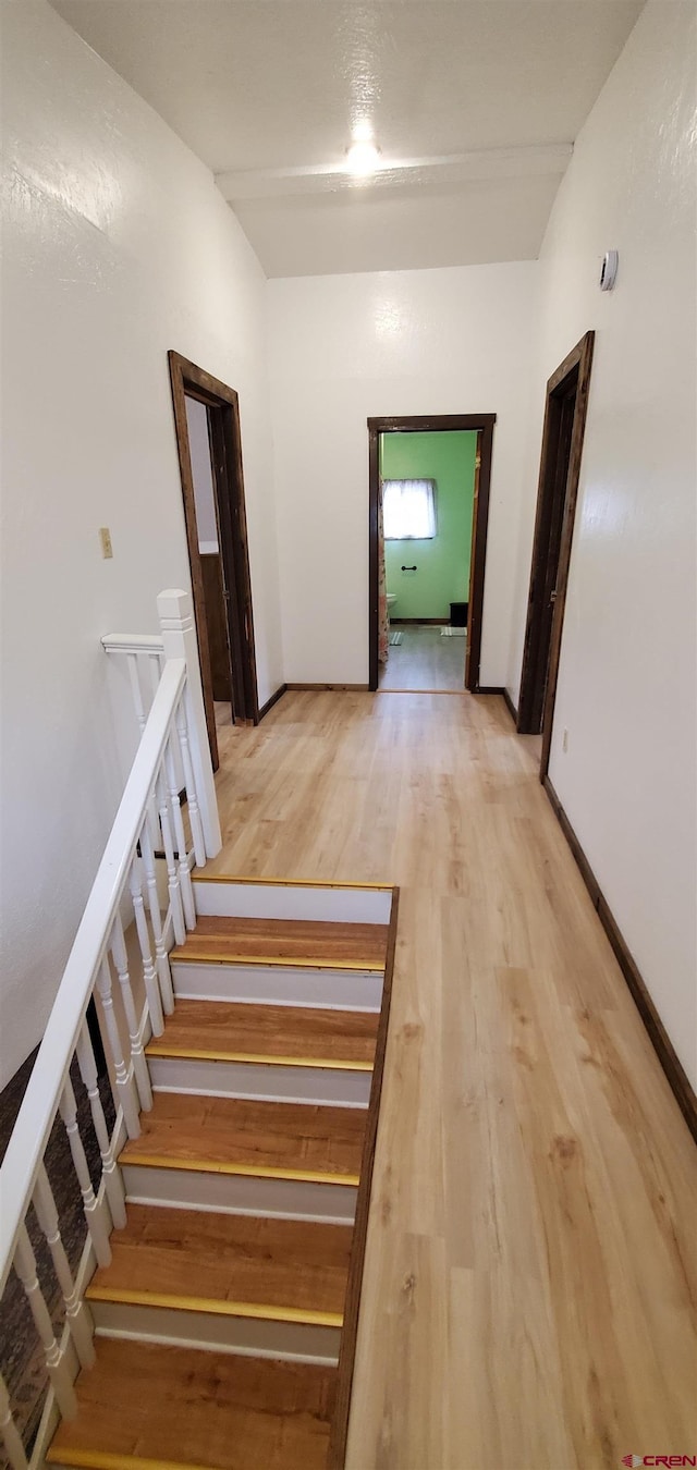 108 N 15th St, Dolores, CO 81323 - hallway with light wood-style flooring and stairway