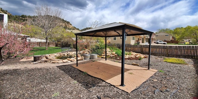 108 N 15th St, Dolores, CO 81323 - view of patio featuring a fenced backyard and a gazebo