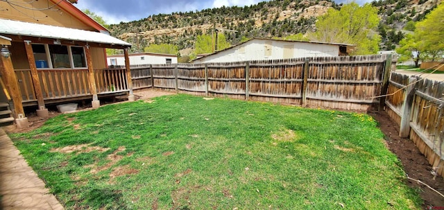 108 N 15th St, Dolores, CO 81323 - view of yard featuring a mountain view and a fenced backyard