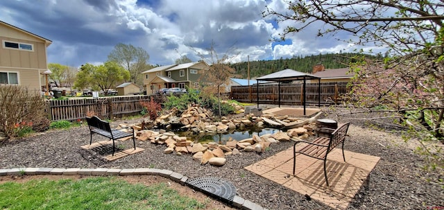 108 N 15th St, Dolores, CO 81323 - view of yard featuring a gazebo, a fenced backyard, and a residential view