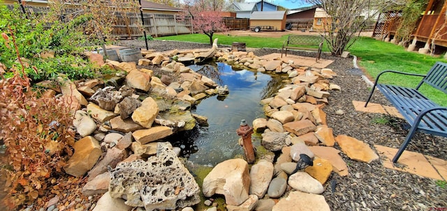 108 N 15th St, Dolores, CO 81323 - details with a garden pond and fence
