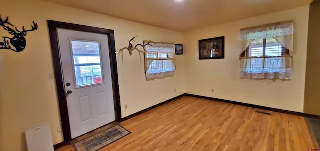 108 N 15th St, Dolores, CO 81323 - interior space featuring baseboards, visible vents, a healthy amount of sunlight, and light wood-style flooring