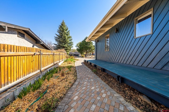view of property exterior featuring fence