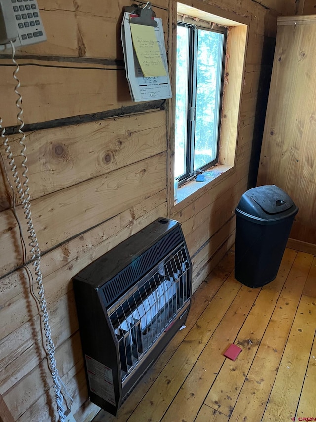 114 Meadowbrook Park, Creede, CO 81130 - room details with heating unit, wood walls, and wood finished floors