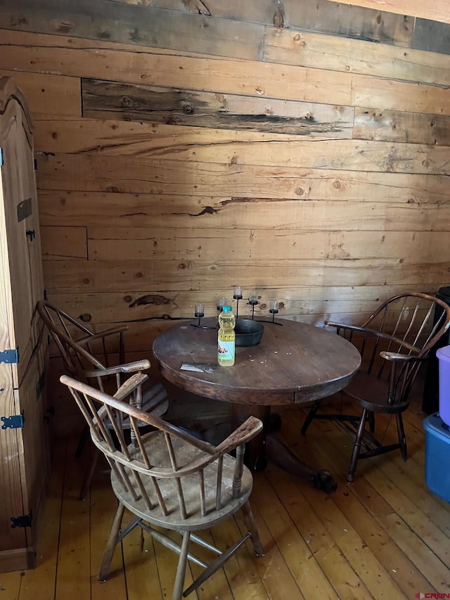 114 Meadowbrook Park, Creede, CO 81130 - dining room featuring wooden walls and hardwood / wood-style flooring