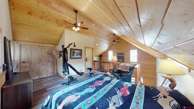 bedroom with wood ceiling, wood walls, vaulted ceiling, and wood finished floors