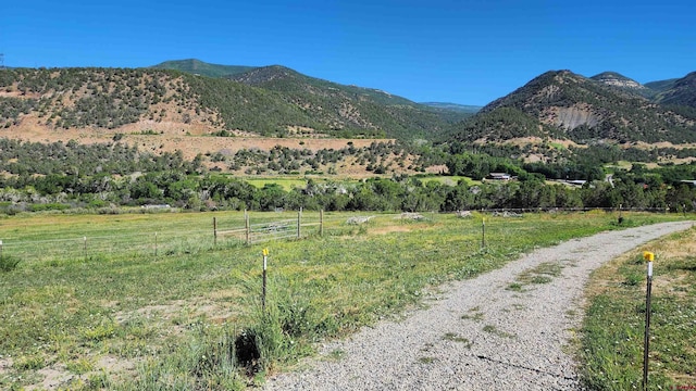 mountain view featuring a rural view