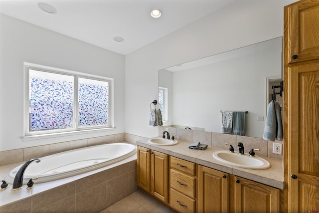 full bathroom with a garden tub, a sink, tile patterned floors, and double vanity