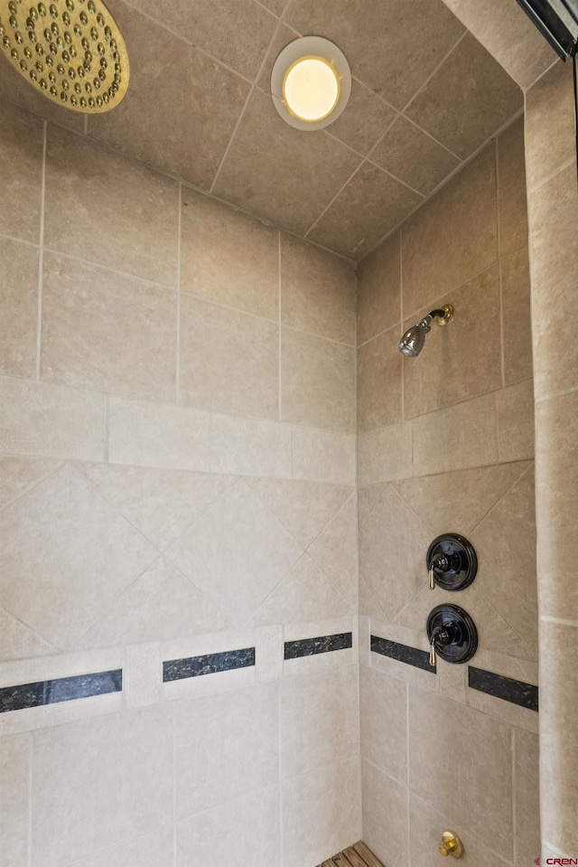 bathroom with tiled shower