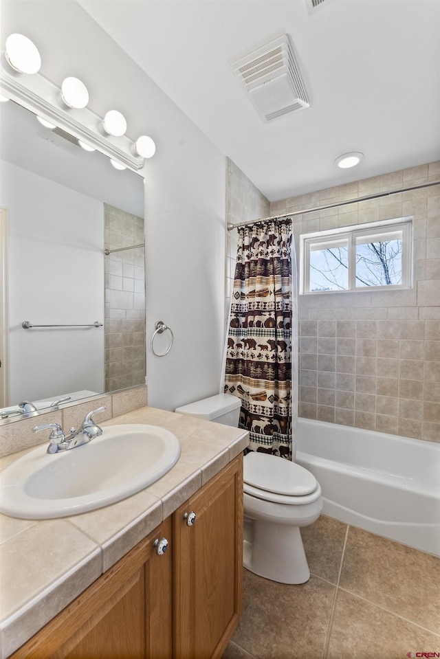 full bathroom with tile patterned flooring, vanity, shower / tub combo with curtain, toilet, and visible vents