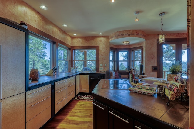 kitchen featuring plenty of natural light, recessed lighting, and wood finished floors