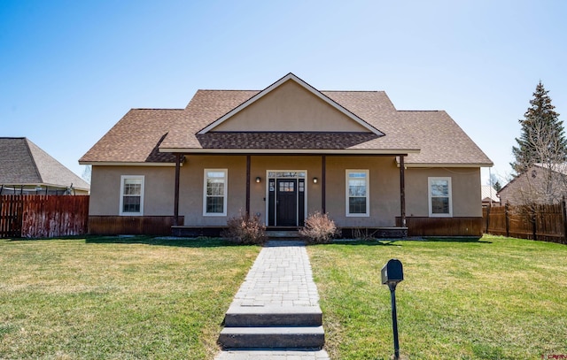 1010 N 11th St, Gunnison, CO 81230 - view of front of house featuring stucco siding and fence