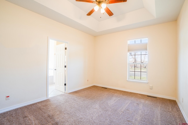 1010 N 11th St, Gunnison, CO 81230 - carpeted spare room with a raised ceiling, ceiling fan, baseboards, and visible vents