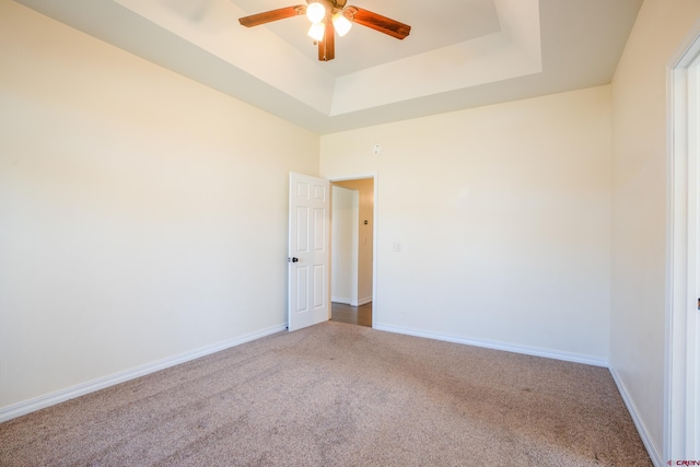 1010 N 11th St, Gunnison, CO 81230 - spare room with carpet flooring, a ceiling fan, baseboards, and a raised ceiling