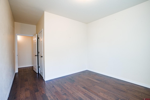 1010 N 11th St, Gunnison, CO 81230 - spare room with baseboards and dark wood-type flooring
