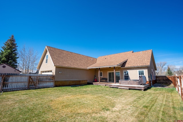 1010 N 11th St, Gunnison, CO 81230 - back of property with a yard, a deck, a fenced backyard, and roof with shingles