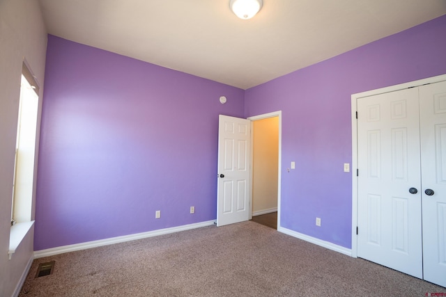 1010 N 11th St, Gunnison, CO 81230 - unfurnished bedroom with carpet floors, baseboards, visible vents, and a closet