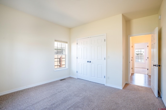 1010 N 11th St, Gunnison, CO 81230 - unfurnished bedroom featuring carpet floors, baseboards, a closet, and visible vents