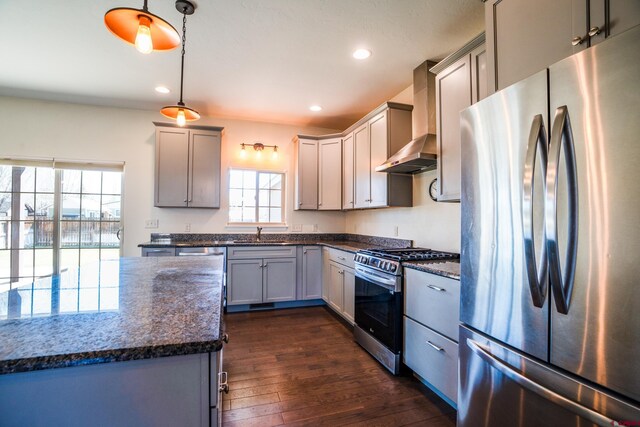 1010 N 11th St, Gunnison, CO 81230 - kitchen with a sink, wall chimney exhaust hood, stainless steel appliances, dark wood-type flooring, and gray cabinetry