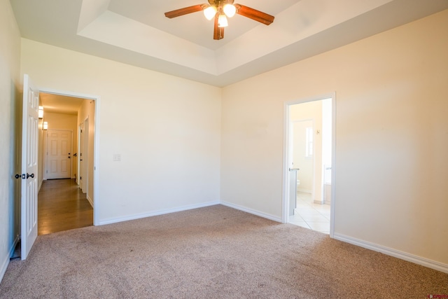 1010 N 11th St, Gunnison, CO 81230 - unfurnished room featuring baseboards, ceiling fan, light carpet, and a tray ceiling