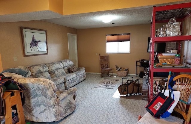 carpeted living area featuring baseboards, a textured ceiling, and visible vents