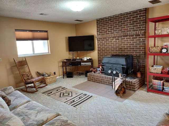 carpeted living area with a wood stove, a textured ceiling, and visible vents