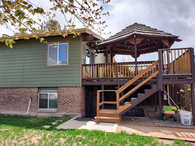 2143 Stratford Dr, Montrose, CO 81401 - rear view of house with stairs, a gazebo, and a deck