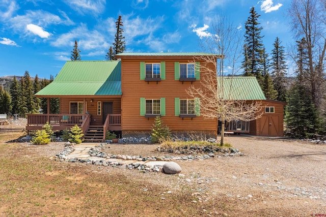746 W Vallecito Crk, Bayfield, CO 81122 - back of property featuring metal roof and a wooden deck
