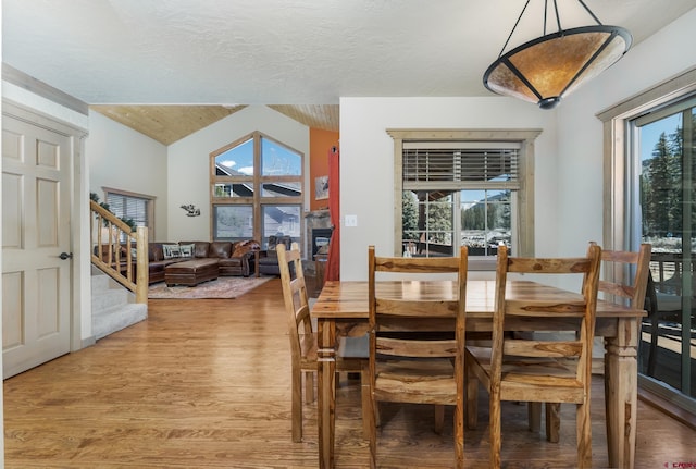 746 W Vallecito Crk, Bayfield, CO 81122 - dining area featuring light wood-style flooring, stairs, and vaulted ceiling